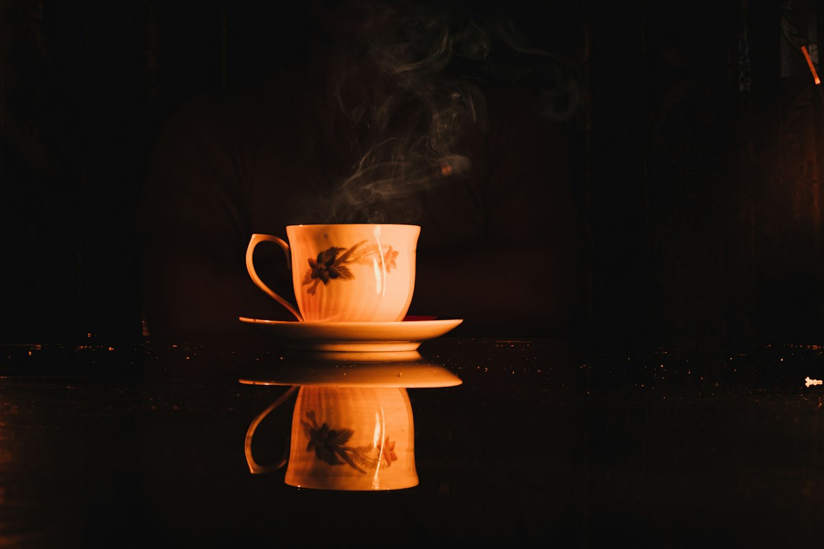 Traditional tea ceremony in progress with porcelain vessels